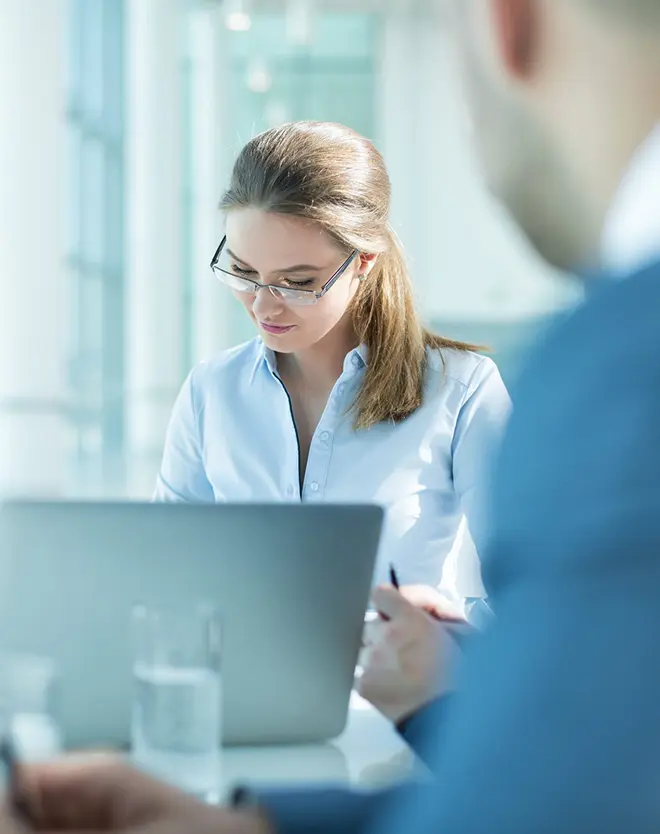 a women is writing on some documents